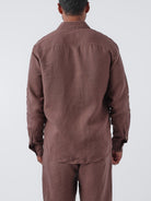 Person wearing an Espresso shirt and pants set on a white background