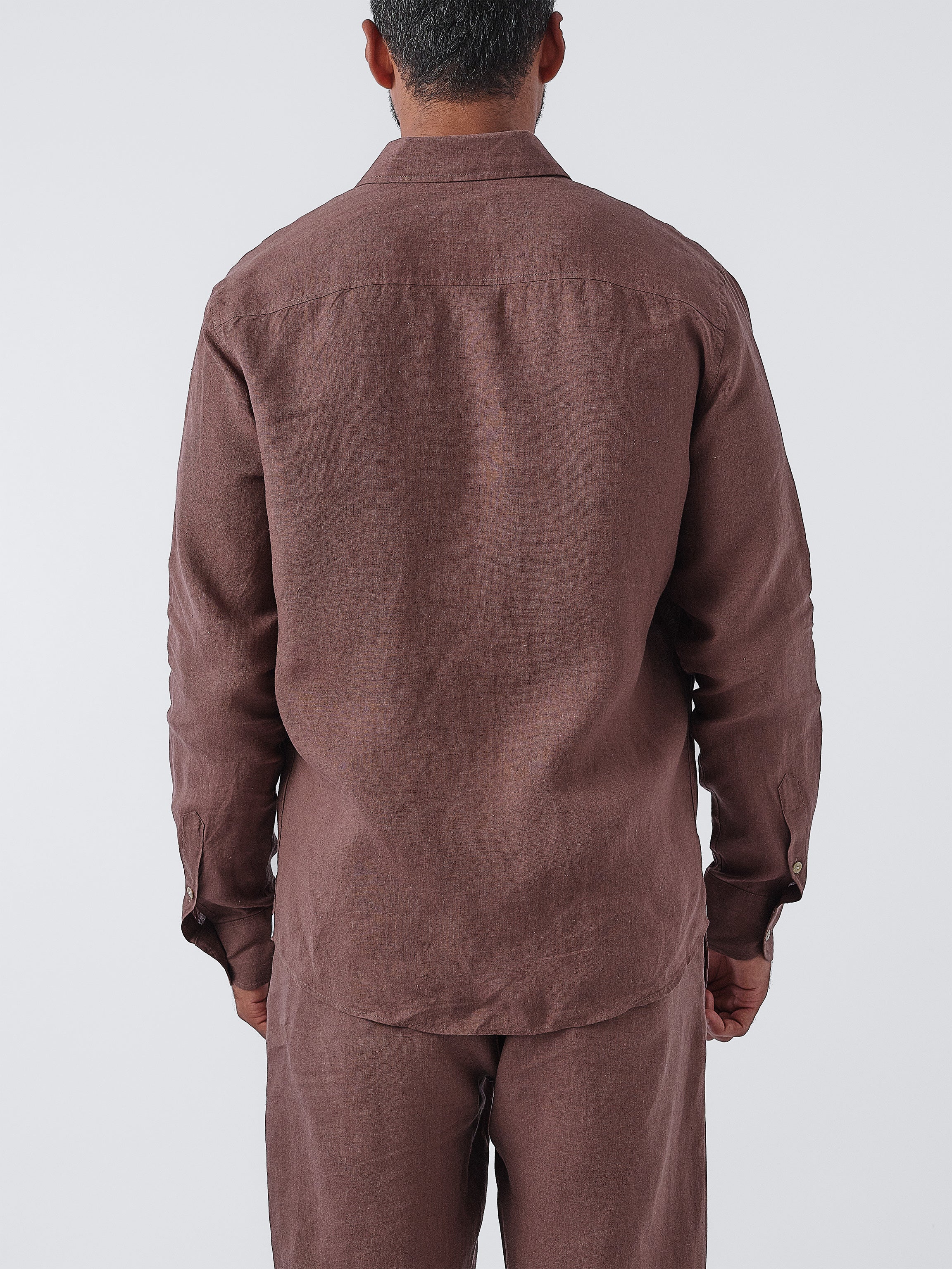 Person wearing an Espresso shirt and pants set on a white background