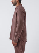 Man wearing an Espresso shirt and pants on a white background