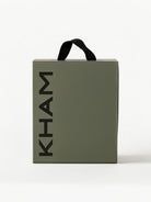 Green bag with 'KHAM' branding on a white background